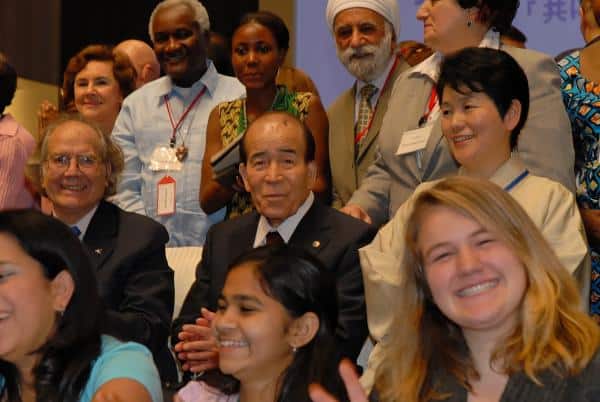 An image of Rev. Takeyasu Miyamoto among his peers at the Arigatou International anniversary celebration.